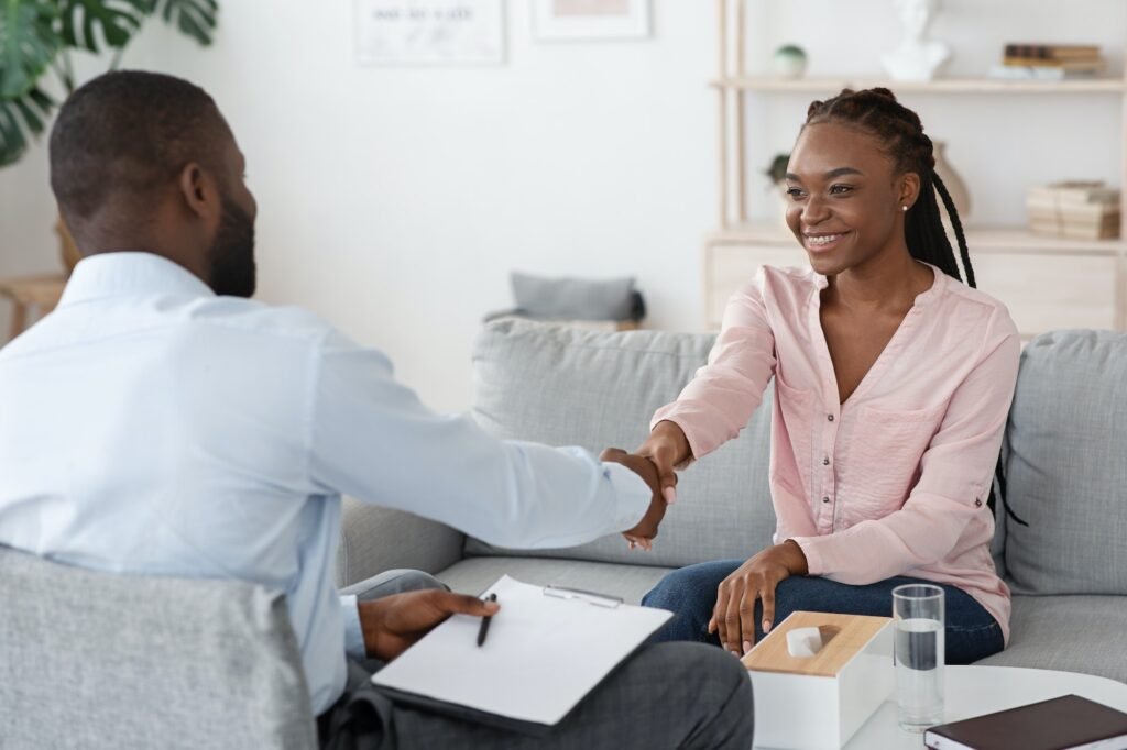 Nice To Meet You. Male therapist greeting black woman at counselling session